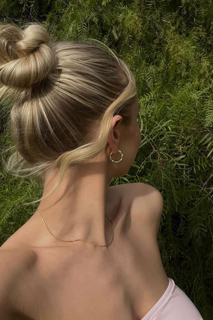 6. Twisted High Bun with Face-framing Curls. Check out 20+ more updos for long hair!