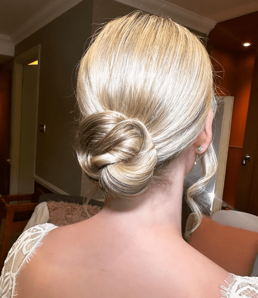 10. Low Knot Updo by @lisabridalhairandmakeup. Check out 20+ more updos for long hair!