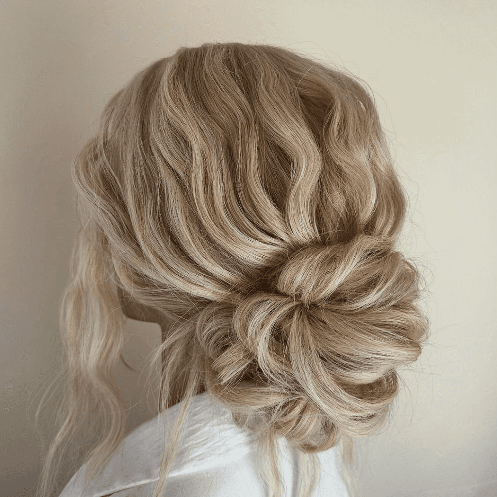 11. Boho Textured Updo by @updos.by.jocelyn. Check out 20+ more updos for long hair!
