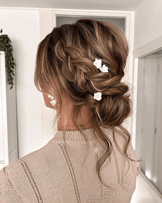 17. Braided Side with Effortless Messy Bun by @absolutely.ineke.hairstyling. Check out 20+ more updos for long hair!