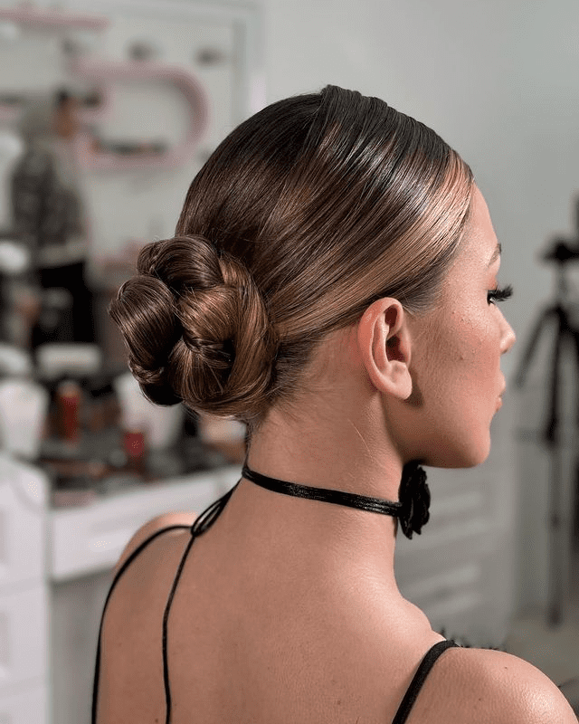 19. Low Bun with Braided Detail by @hairnura. Check out 20+ more updos for long hair!