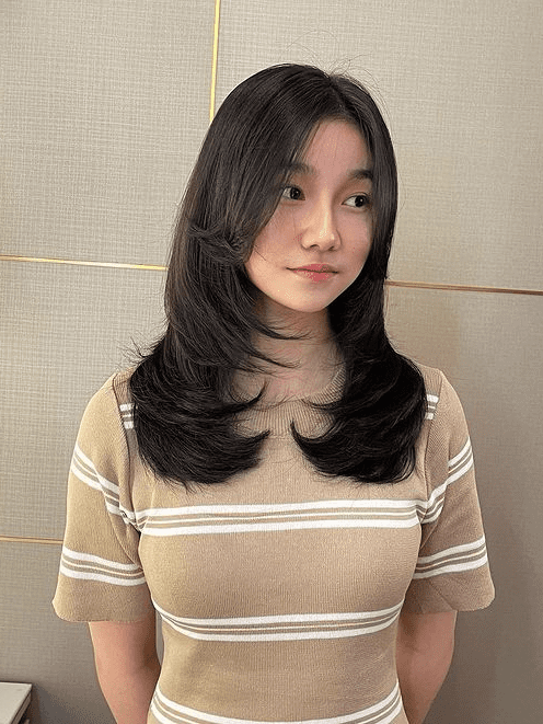 5. Three-Layer Cut with Curtain Bangs by @felix_kiekiesalon. Click here to learn more about Korean layers!