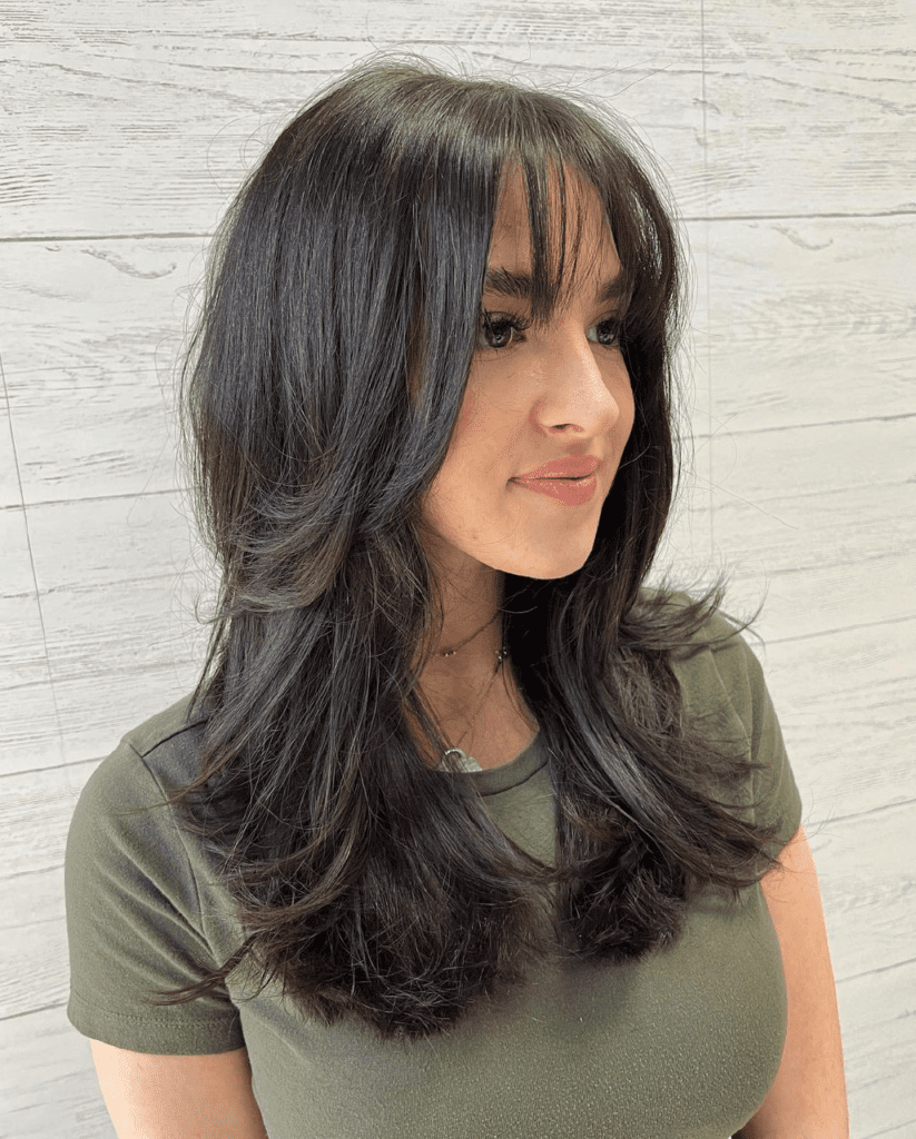 Medium-Length Butterfly Cut with Wispy Bangs