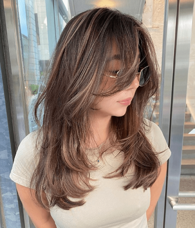 Dark Brown Medium-Length Butterfly Cut with Caramel Balayage